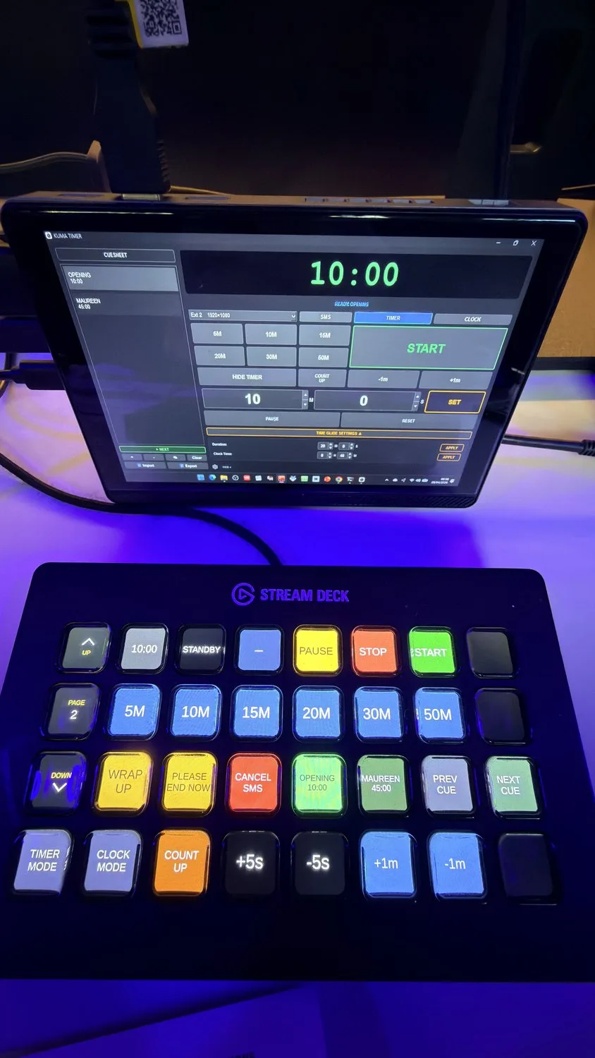 A Stream Deck driven through Bitfocus Companion next to a KUMA control window.